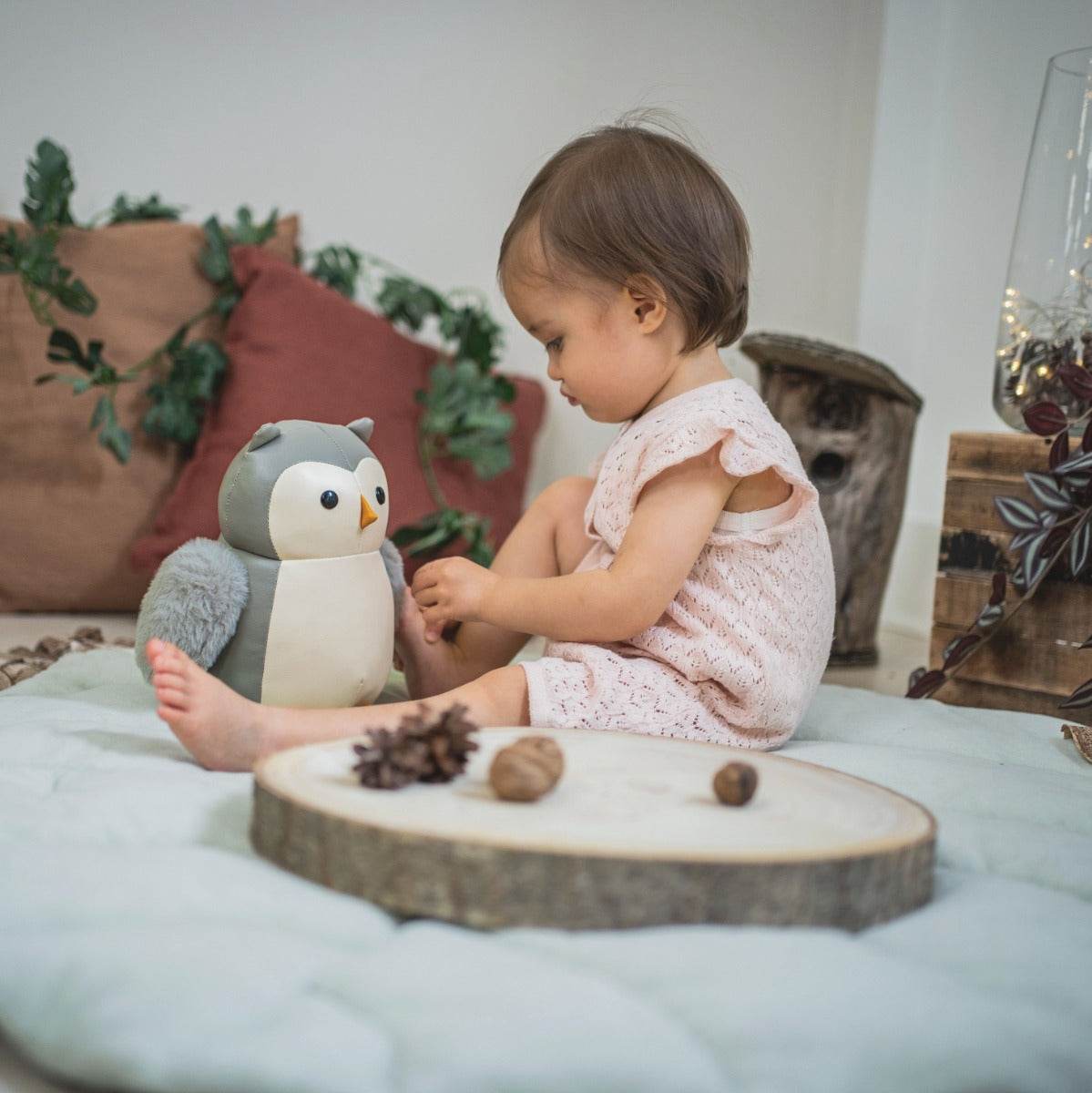 Little girl playing with Little big friends musical friends Colette the Owl