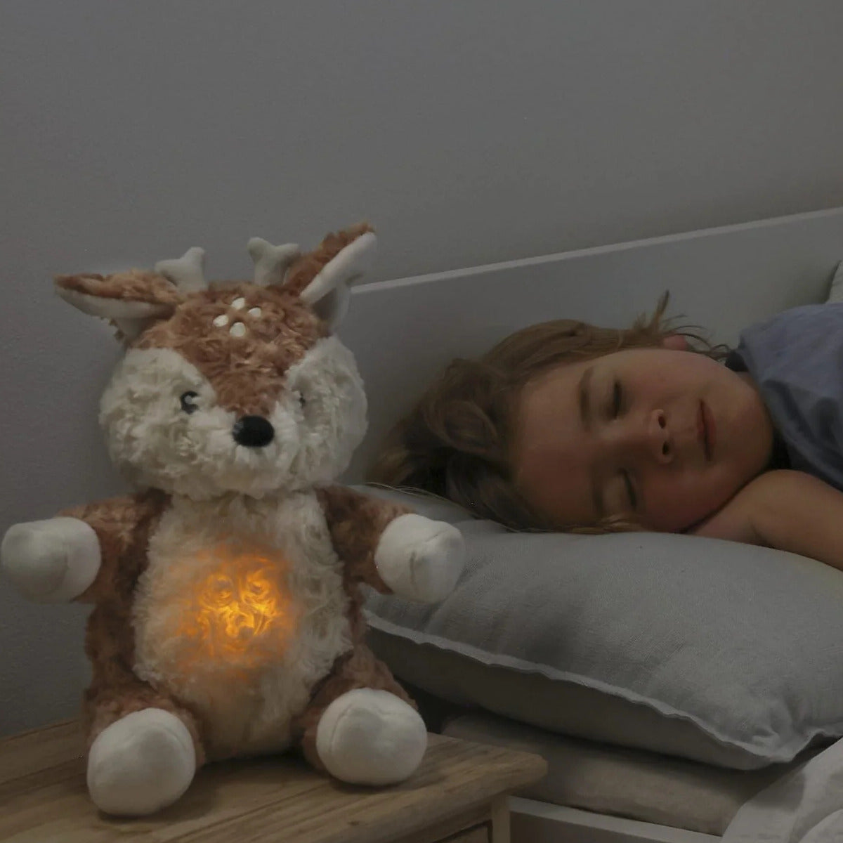 Little girl sleeping with Lovelight Buddies - Finley Fawn