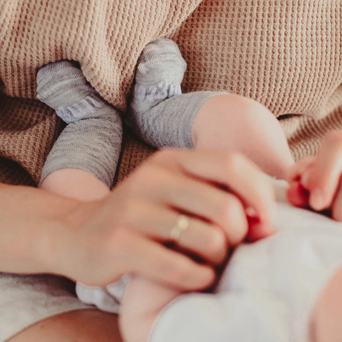 Baby wearing Merino Wool Crew Socks in grey with chevrons