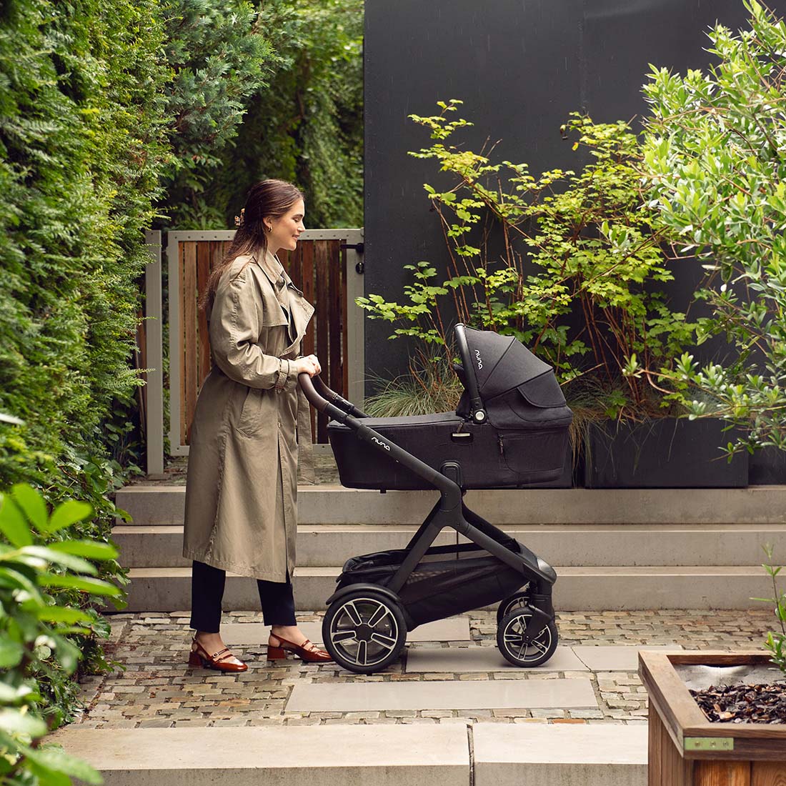 Mother with Nuna Demi Carry Cot attached with a stroller