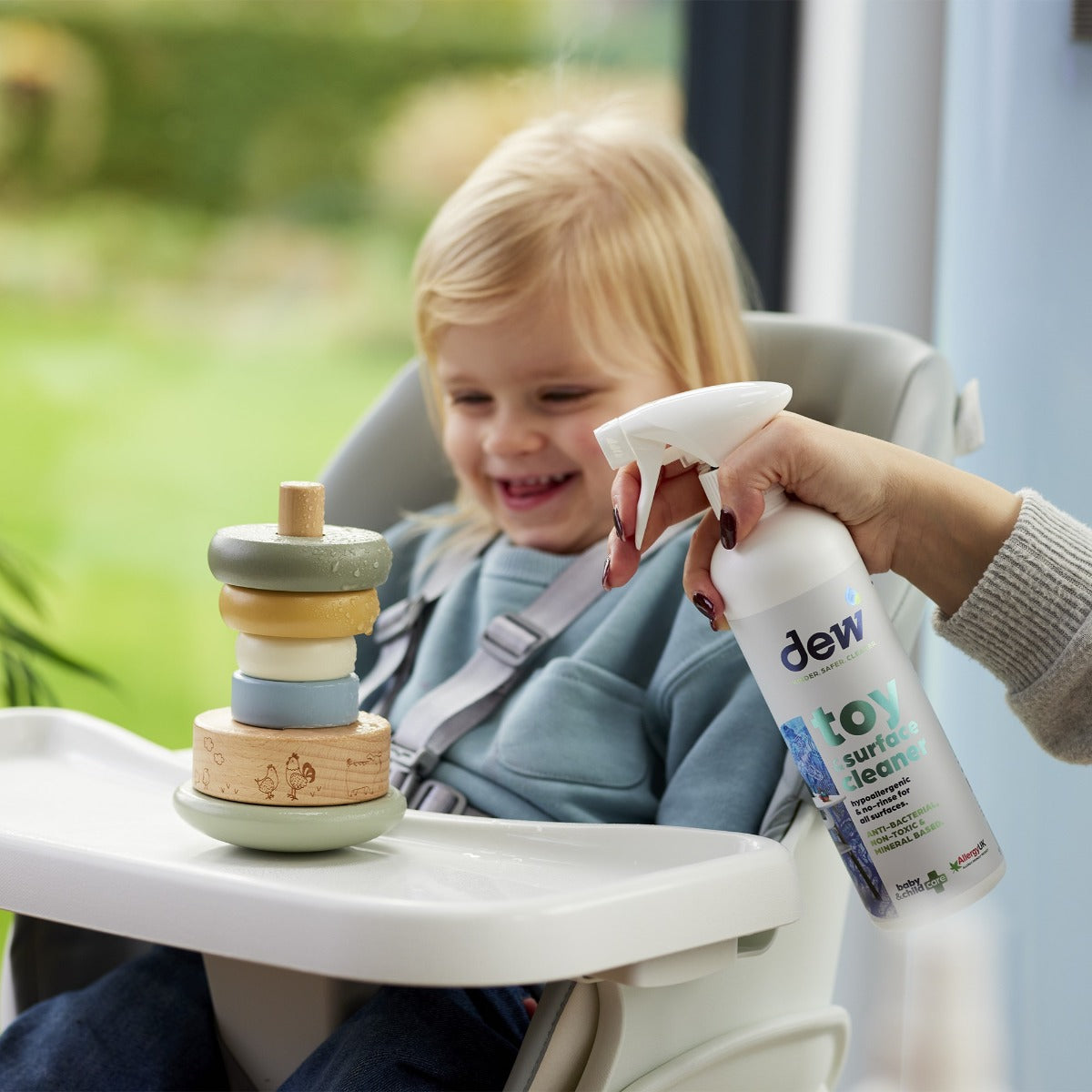 Mother cleaning toys with Toy & Surface Sanitizer