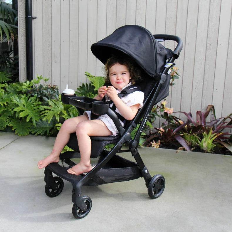 Baby out & About in Lucci pram with snack tray attached