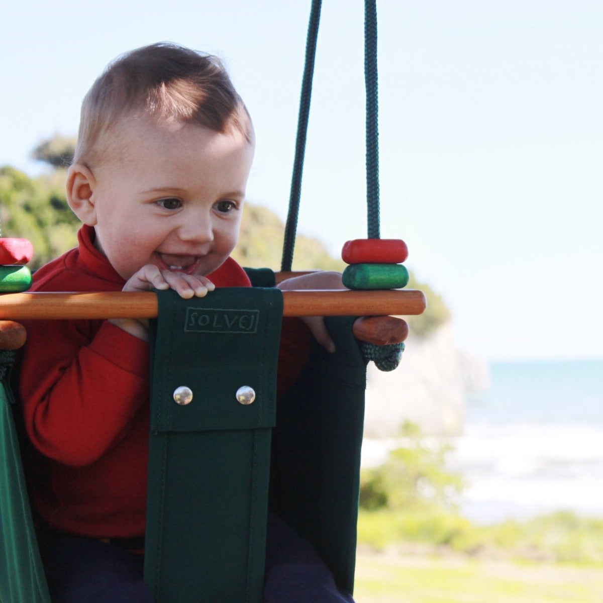 SOLVEJ Baby Toddler Swing in forest green lifestyle