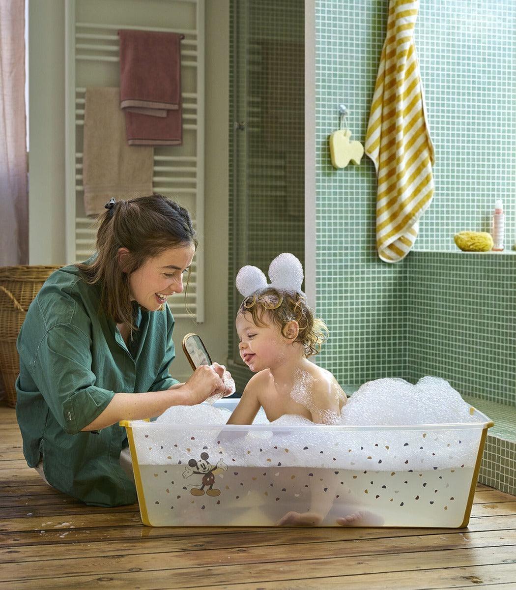 Stokke Flexi Bath in Mickey design with happy family bathing
