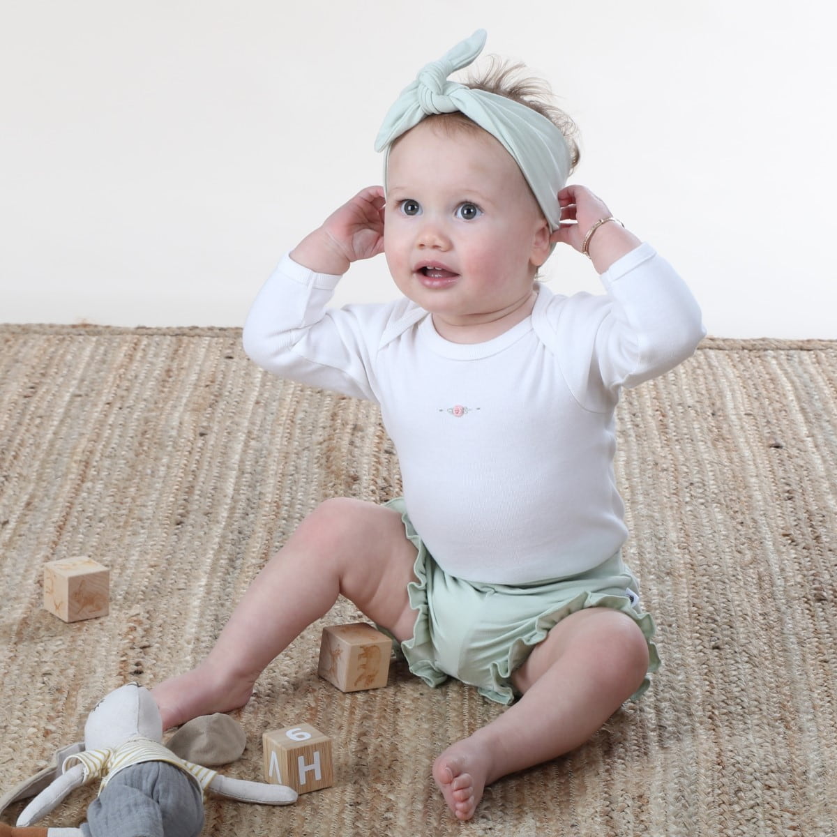 Dimples baby clothing cotton long sleeve bodysuit in white rose on baby