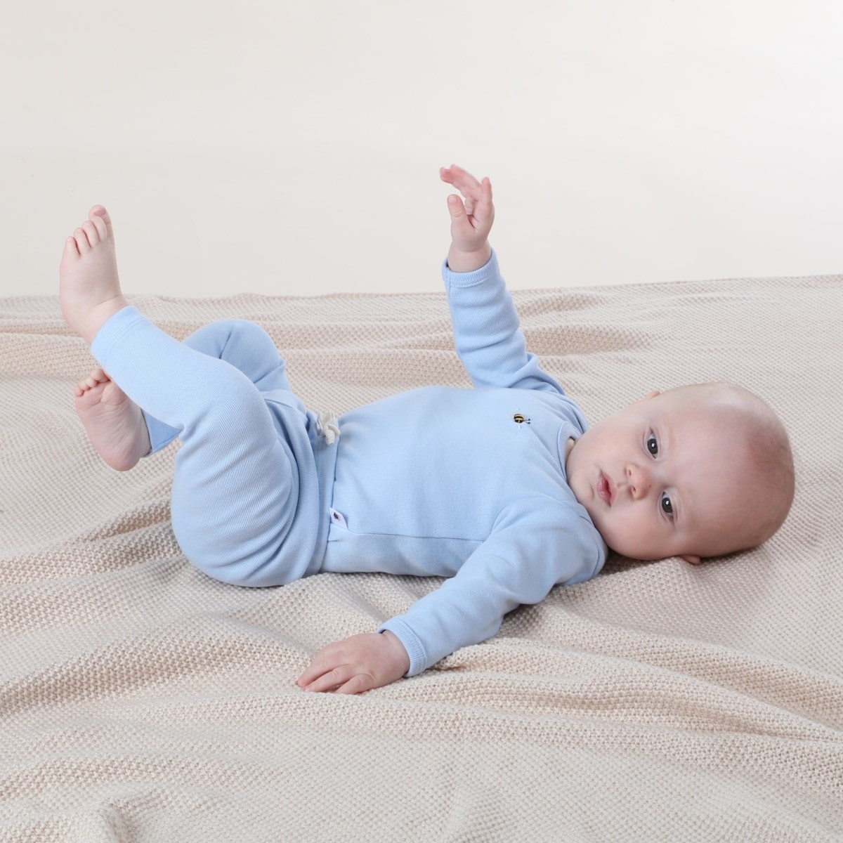 baby boy sleeping wearing cotton legging and long sleeve top