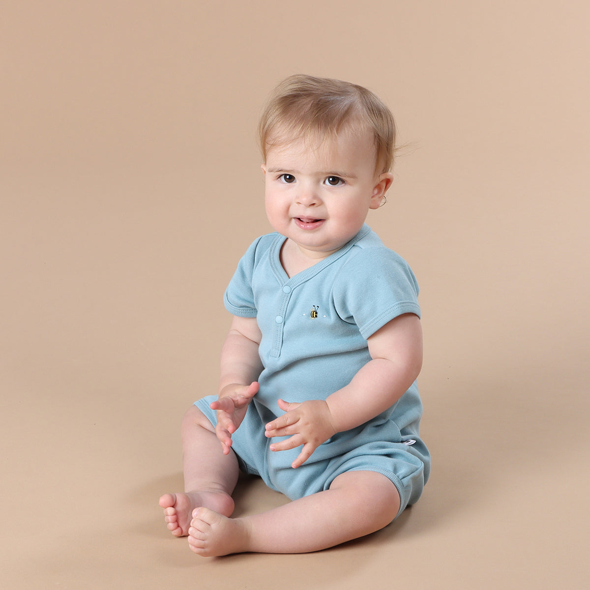 Baby girl wearing Ocean Cotton romper