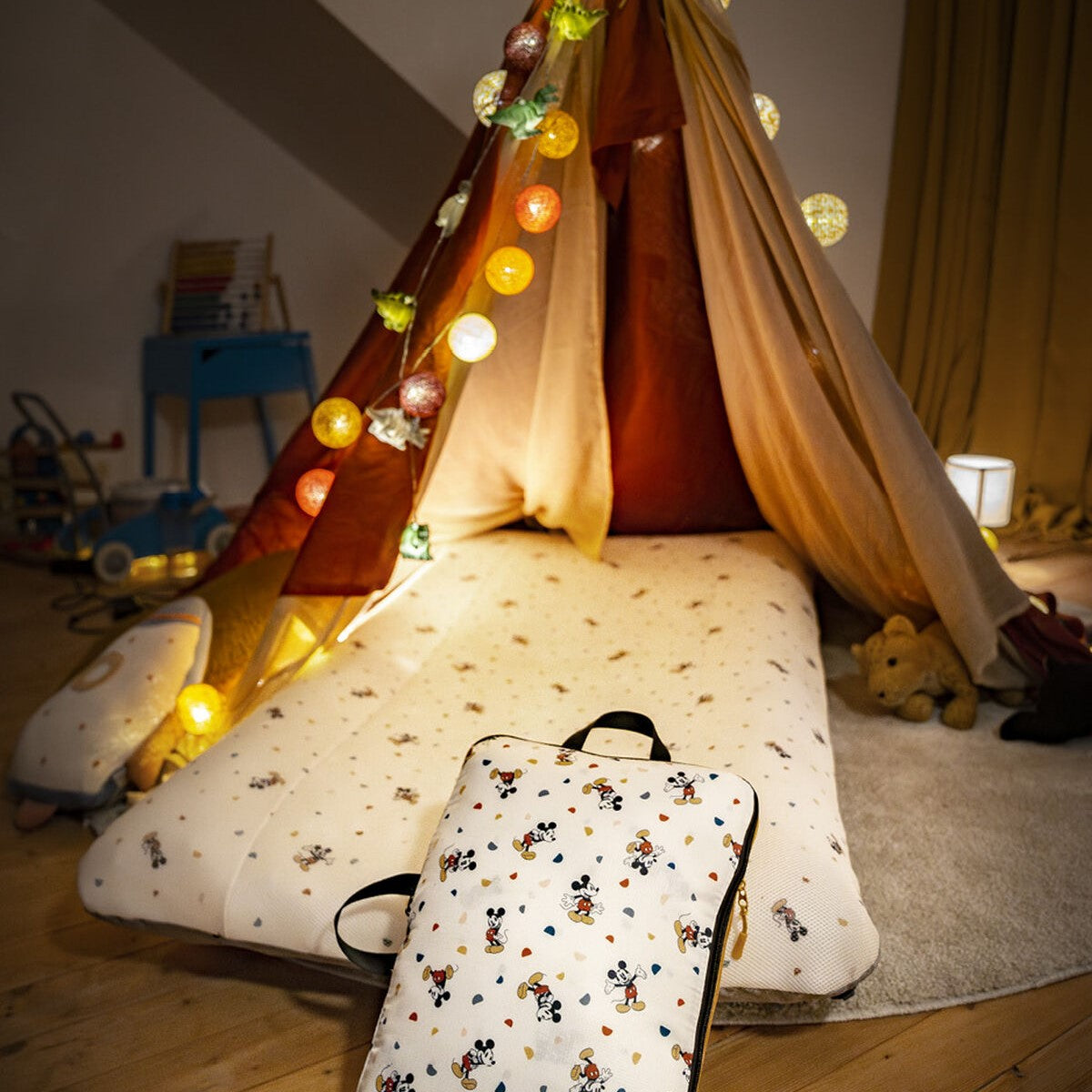 Stokke Mickey jetkids cloud sleeper in a kids room inside tent with lights