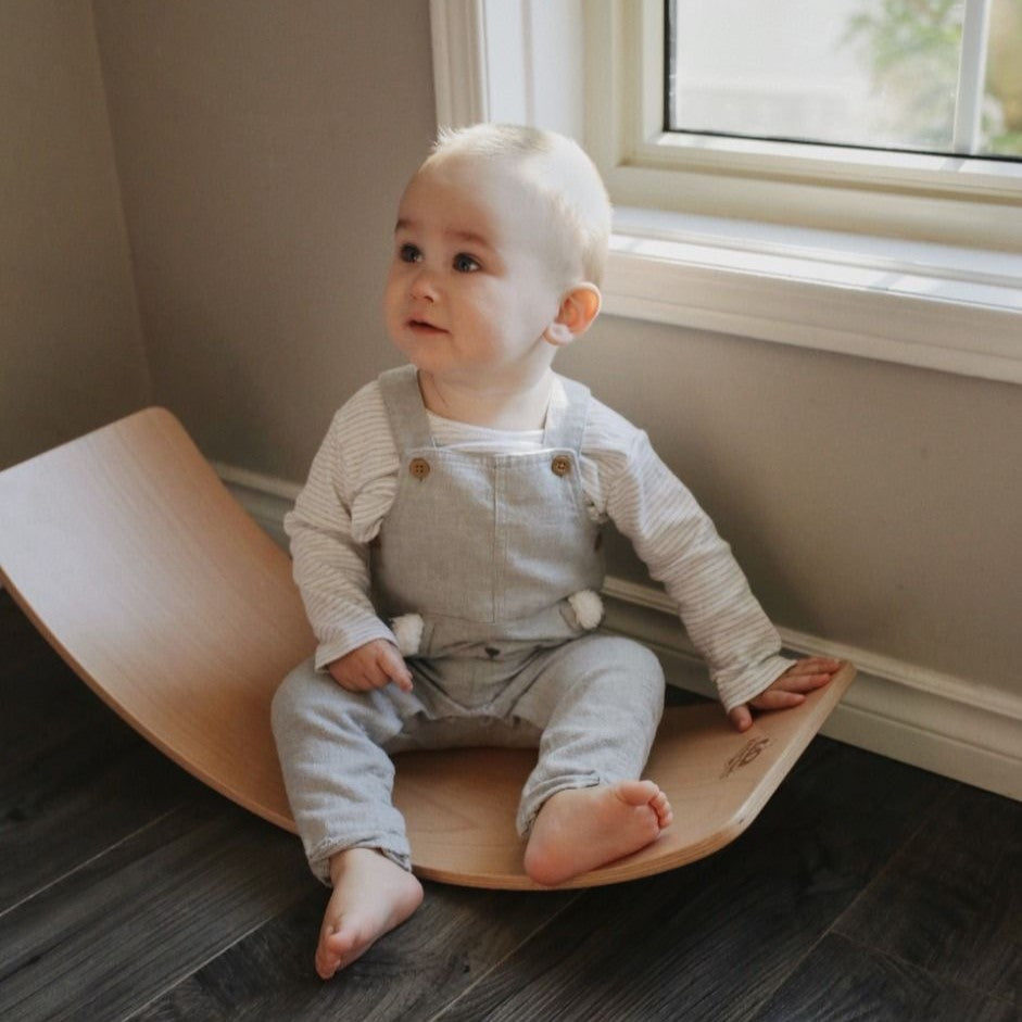 Child sitting on Kinderfeets Lite Board