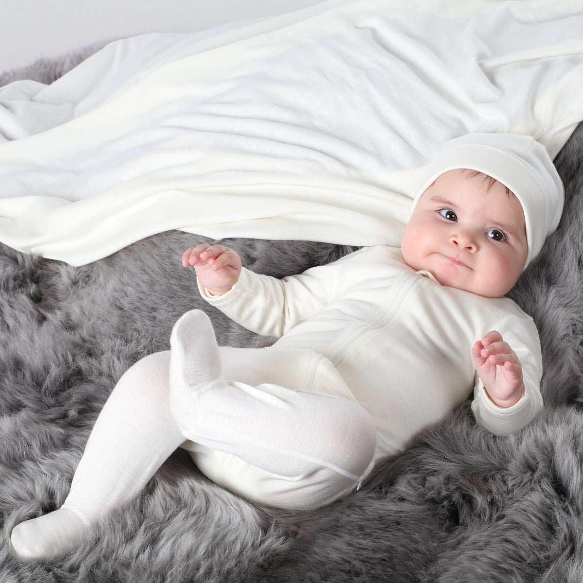 Little Bee Merino Zip up babygrow in cream