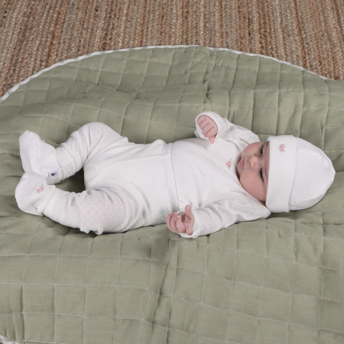 Dimples Cotton Longsleeve Bodysuit in white rose on baby