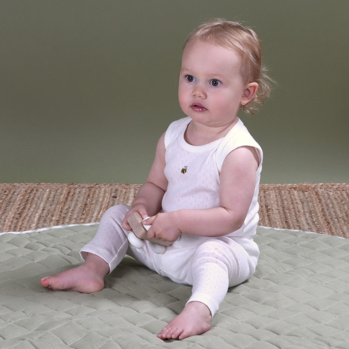 Dimples cotton sleeveless bodysuit on baby