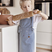 Striped denim elephant apron lifestyle shot