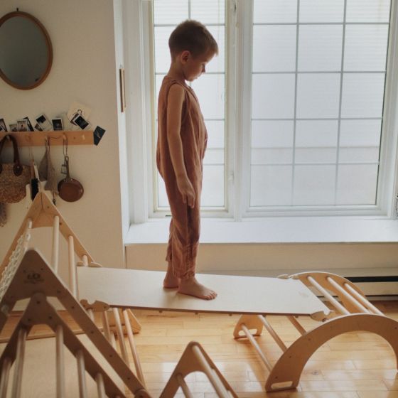 Little Boy Standing on Kinderfeets Pikler Ramp/Slide
