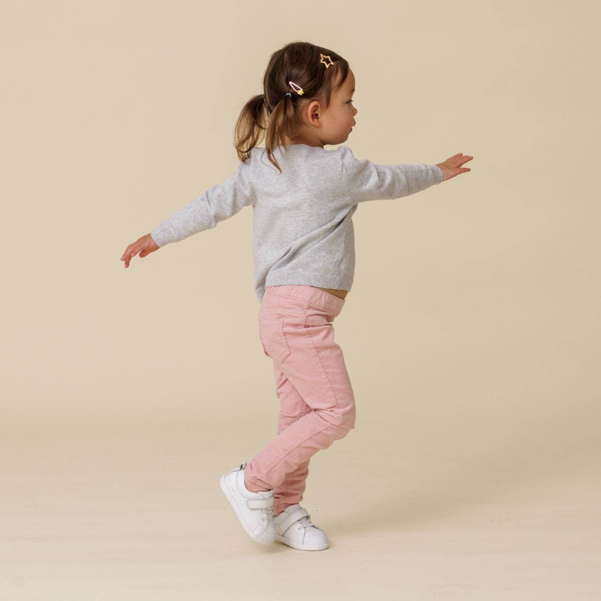 Baby walking, wearing 1st walker white shoes
