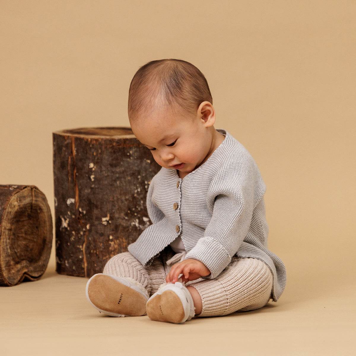 Baby wearing winter cosy fur baby shoes