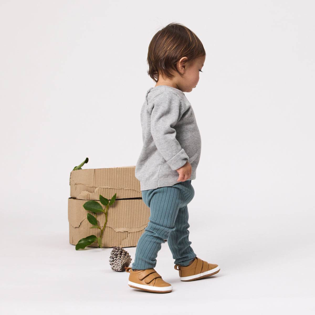 Baby boy standing wearing Unisex Baby Scout in tan from Pretty Brave