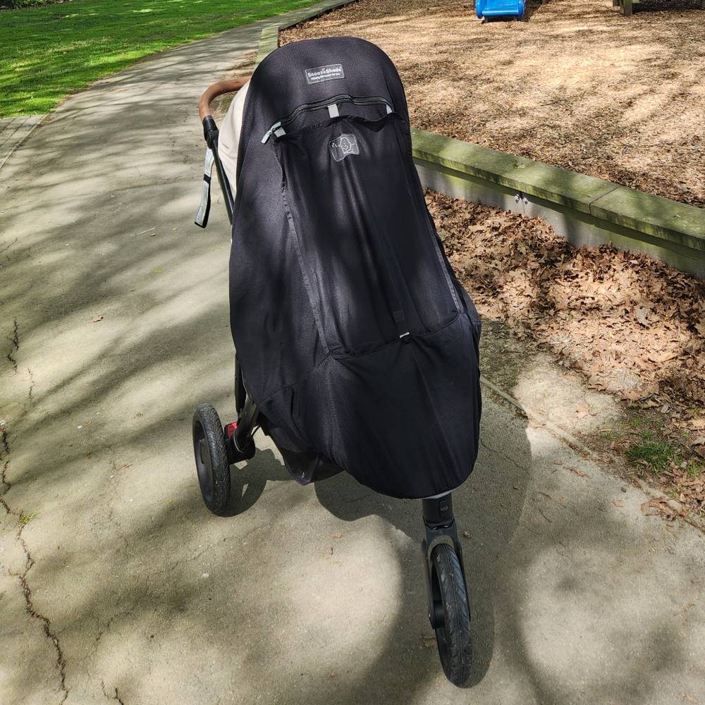 Snooze shade attached to stroller