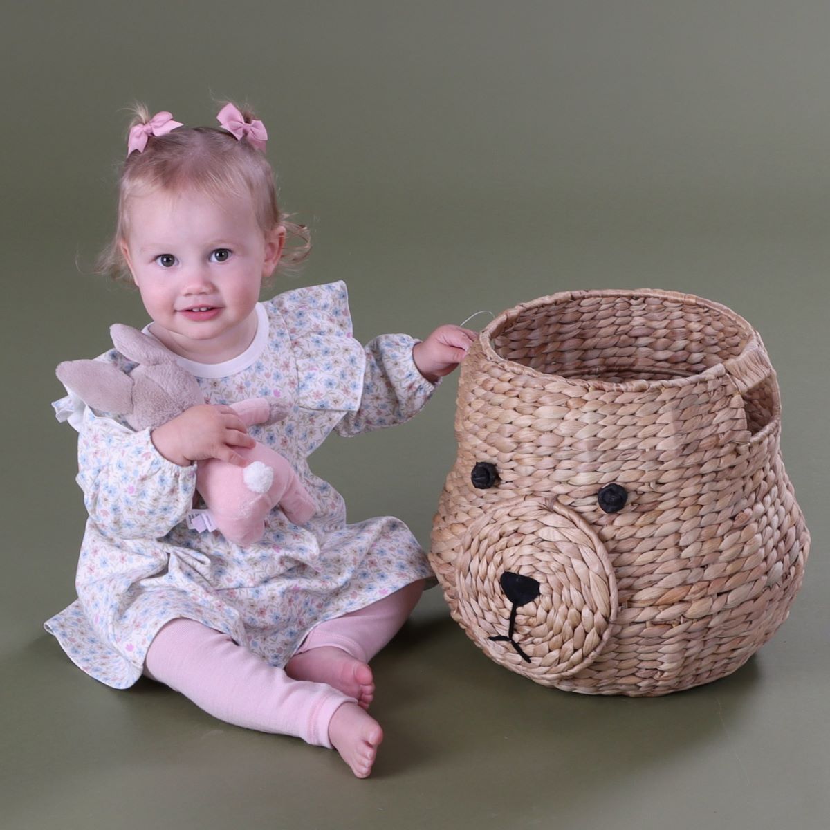 Baby girl playing with bunny wearing Cotton Fleece long sleeve Floral dress pairing it with merino leggings