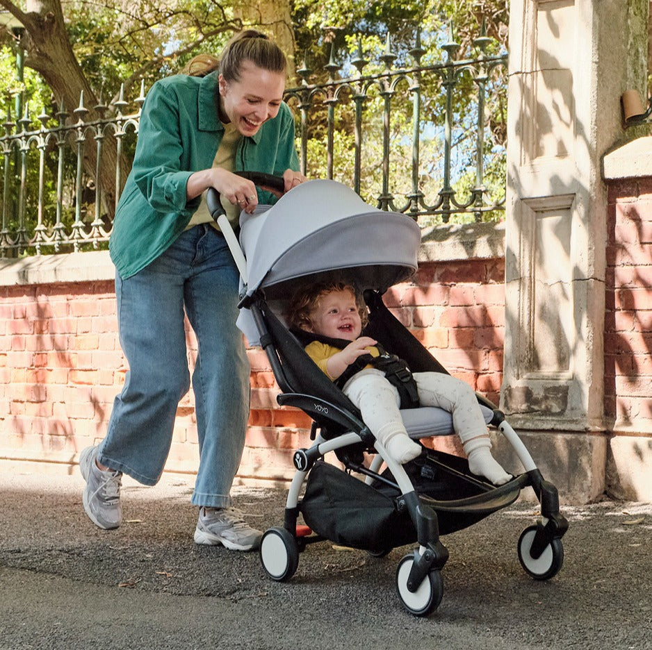 Mother using YOYO3 Stroller for a baby with a stone 6+ colour pack