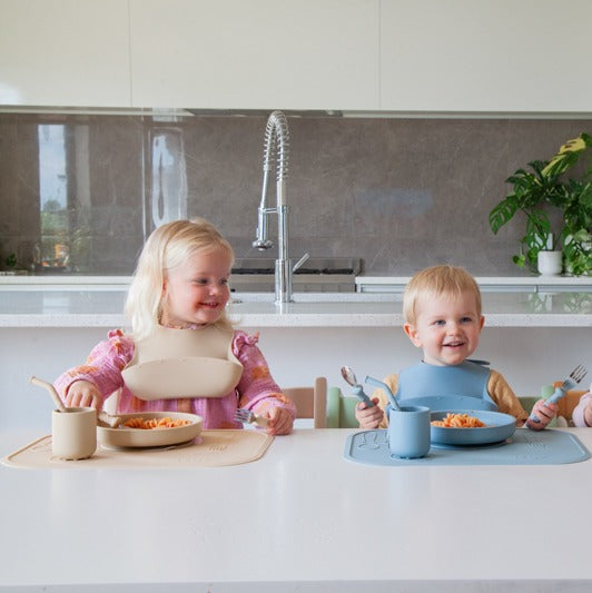 Kids eating from silicone plate with cutlery and cup from Zazi