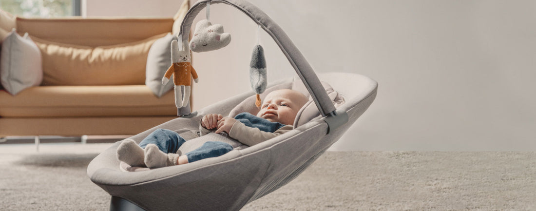 Baby sleeping in a nuna lead grow