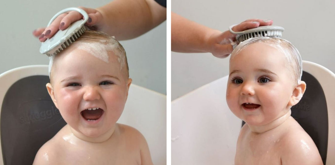 Baby happily sitting in Shnuggle bath while mother brushing babies head