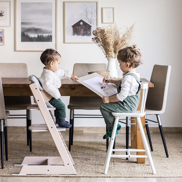 Stokke tripp trapp highchair in Whitewash in lifestyle setting with babies