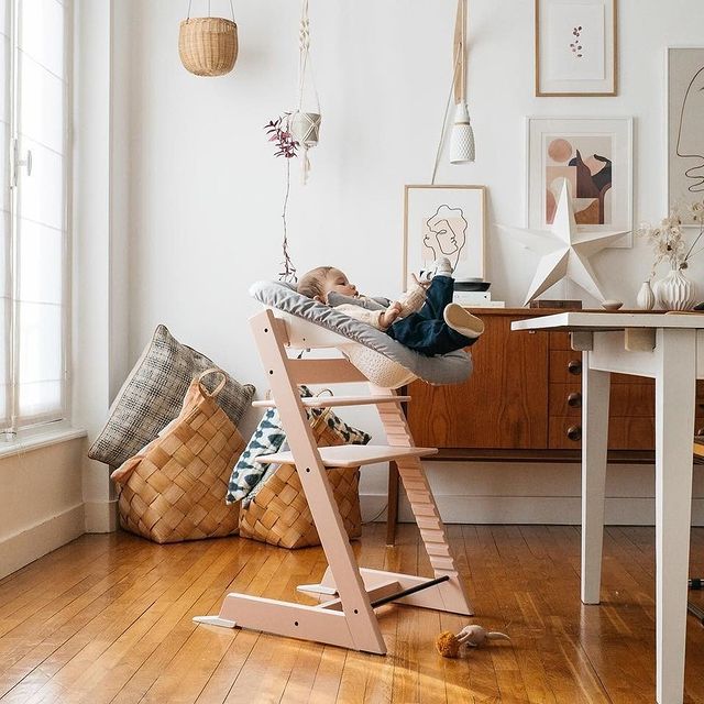 Stokke tripp trapp highchair in Serene Pink lifestyle setting with newborn set attachement