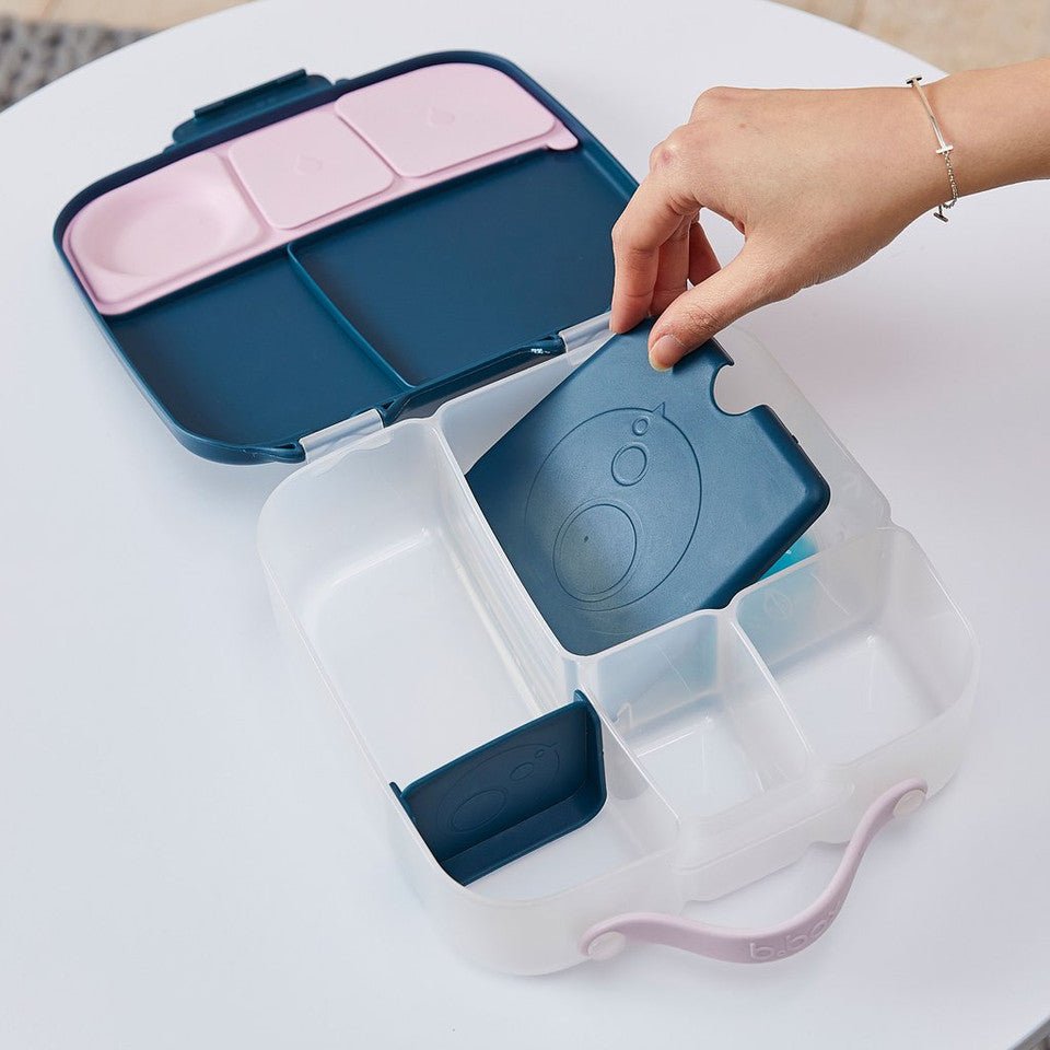 Lady putting B.Box Gel Cooler Twin Pack in a lunch box and coning the lid