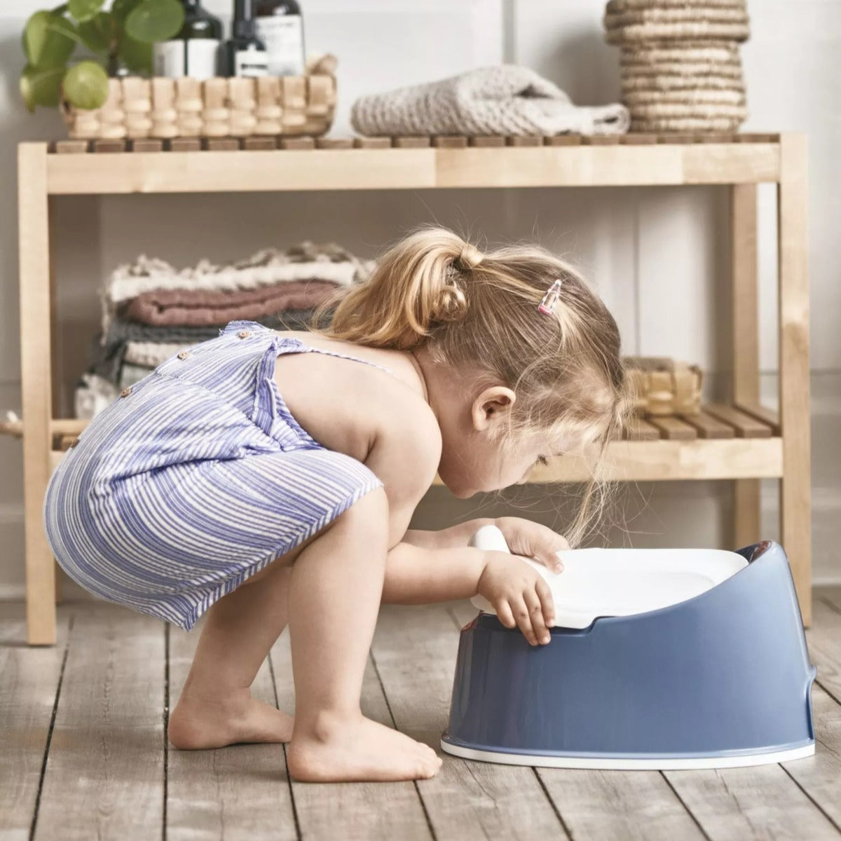 Baby girl with Babybjorn Blue Smart Potty seat