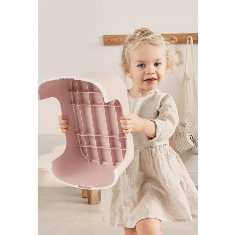 Baby girl easily holding Babybjorn Powder Pink Step Stool