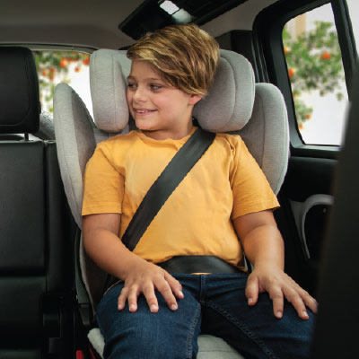 Kids sitting happily in aace lx car seat in car