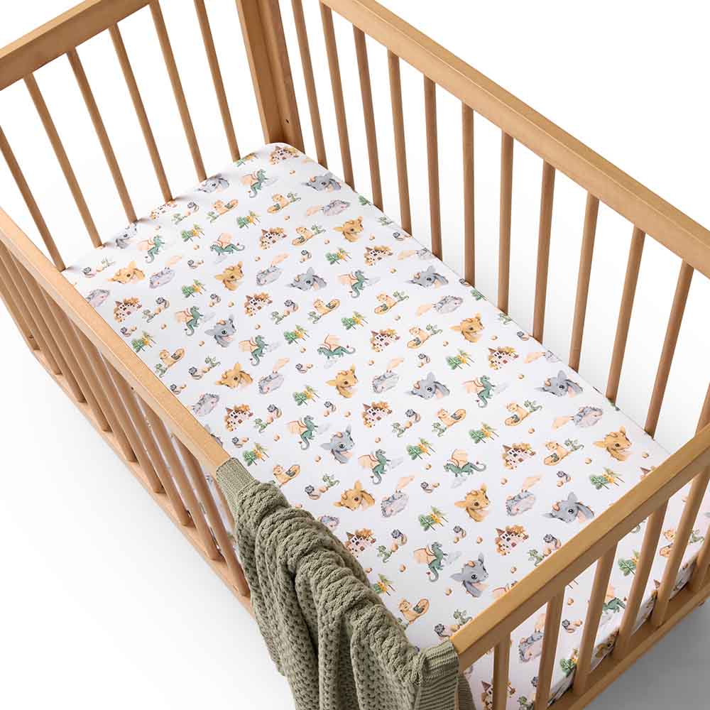 Snuggle Hunny organic cotton cot sheet in dragon print in cot