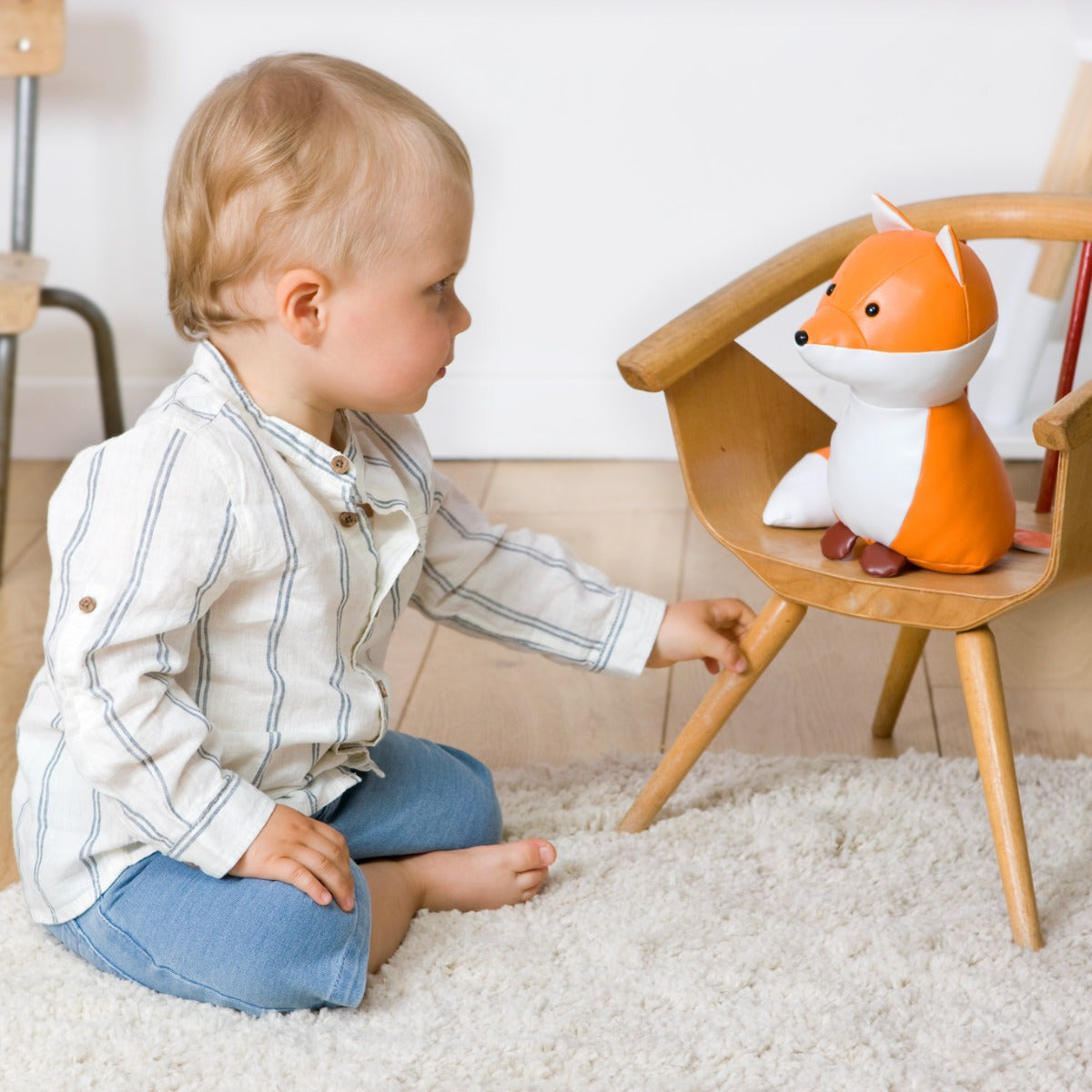 Baby boy staring Little big friends Richard the fox musical friend front view