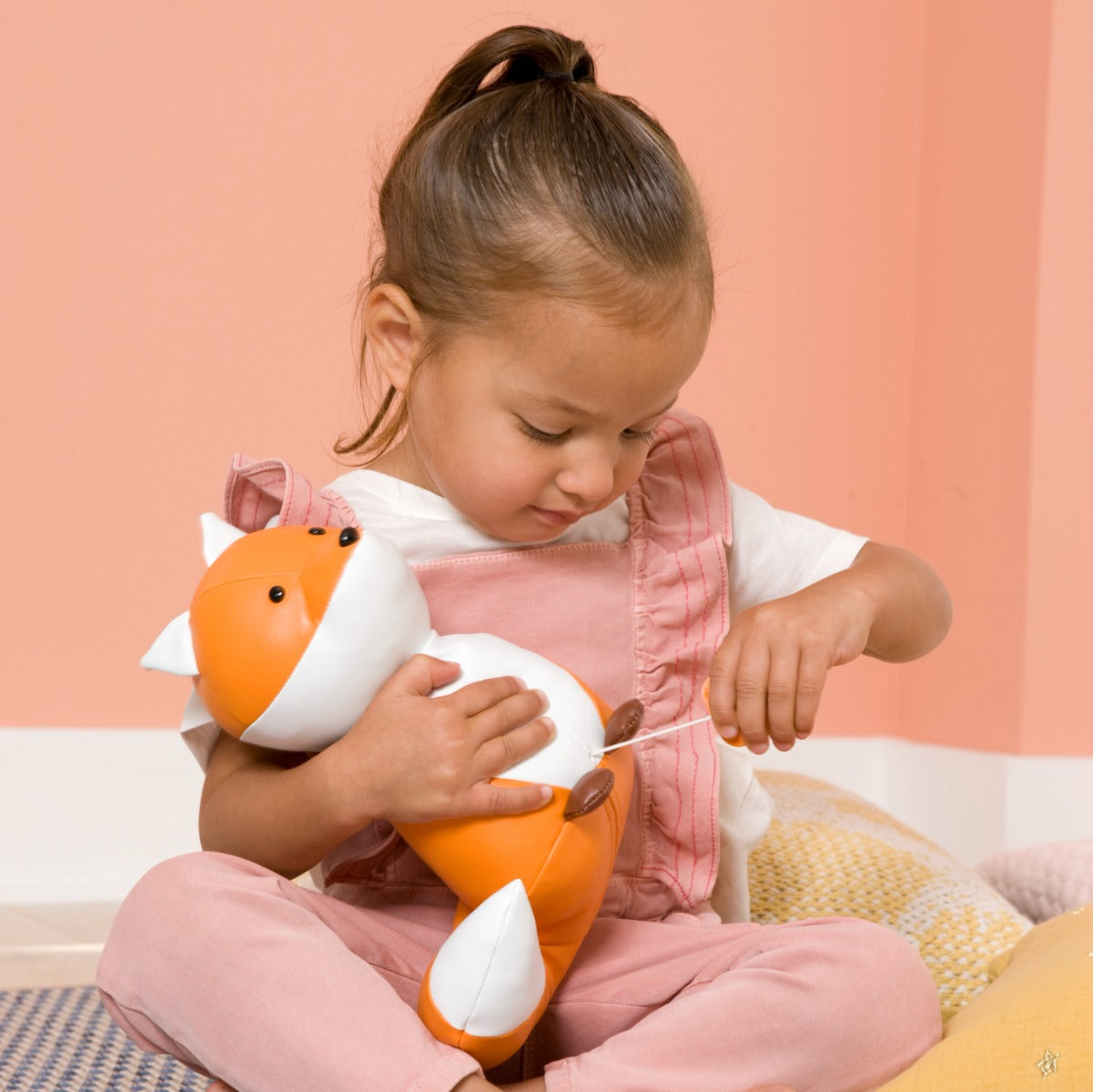 Girl holding Little big friends richard the fox musical friend front view