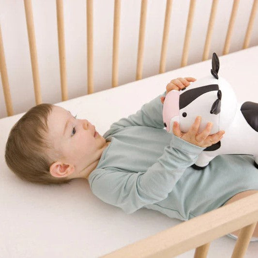Baby holding Emma the Cow 