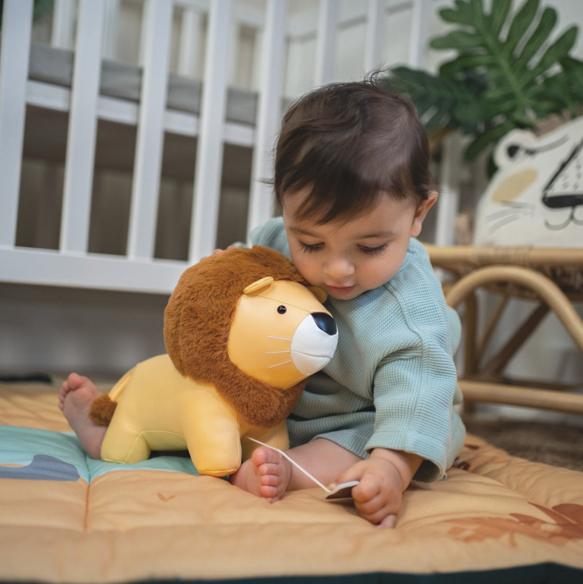 little boy playing with Little big friends musical friends Jackson the lion