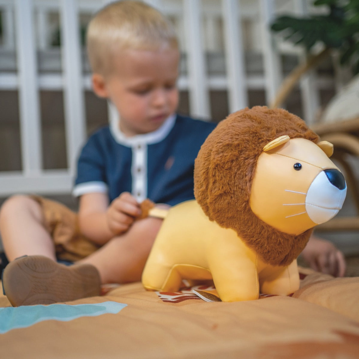 Baby Boy playing with Little big friends musical friends Jackson the lion
