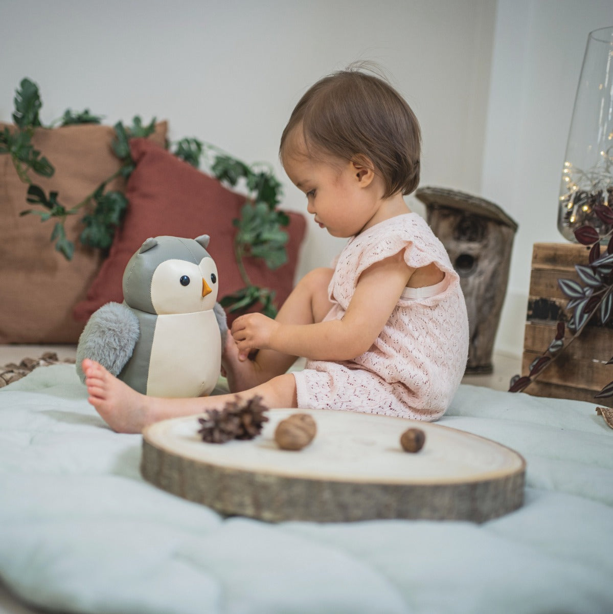 Little girl playing with Little big friends musical friends Colette the Owl