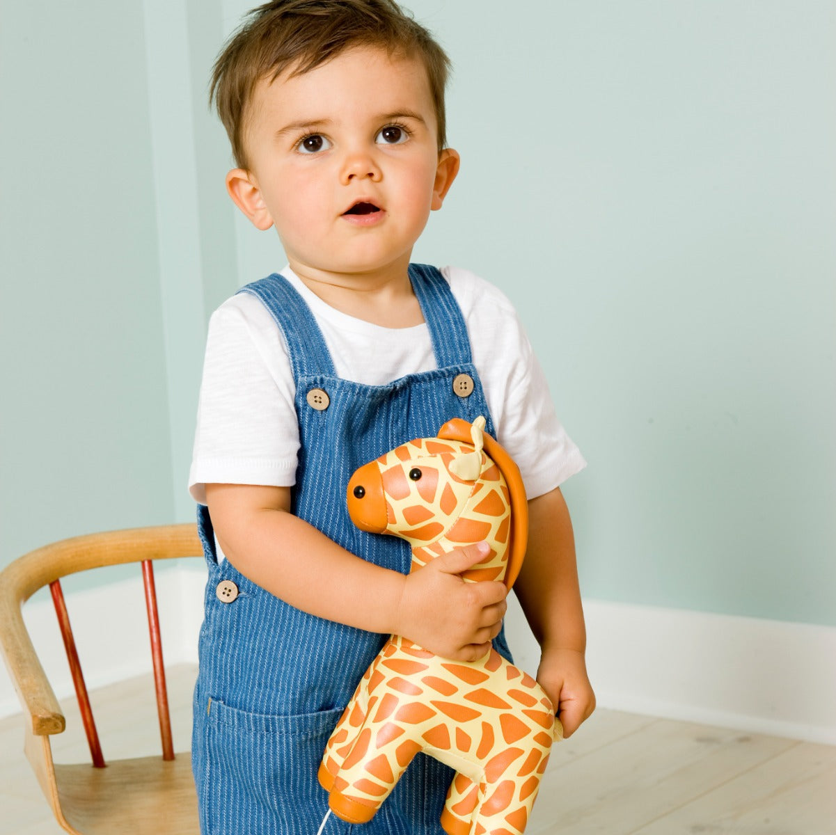 Baby boy playing with Musical Friends - Gina the Giraffe from Little Big Friends