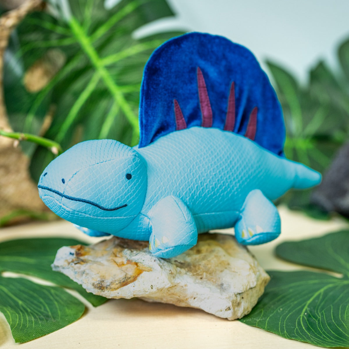 Little big friends Dimitri the Dimetrodon sitting on a rock