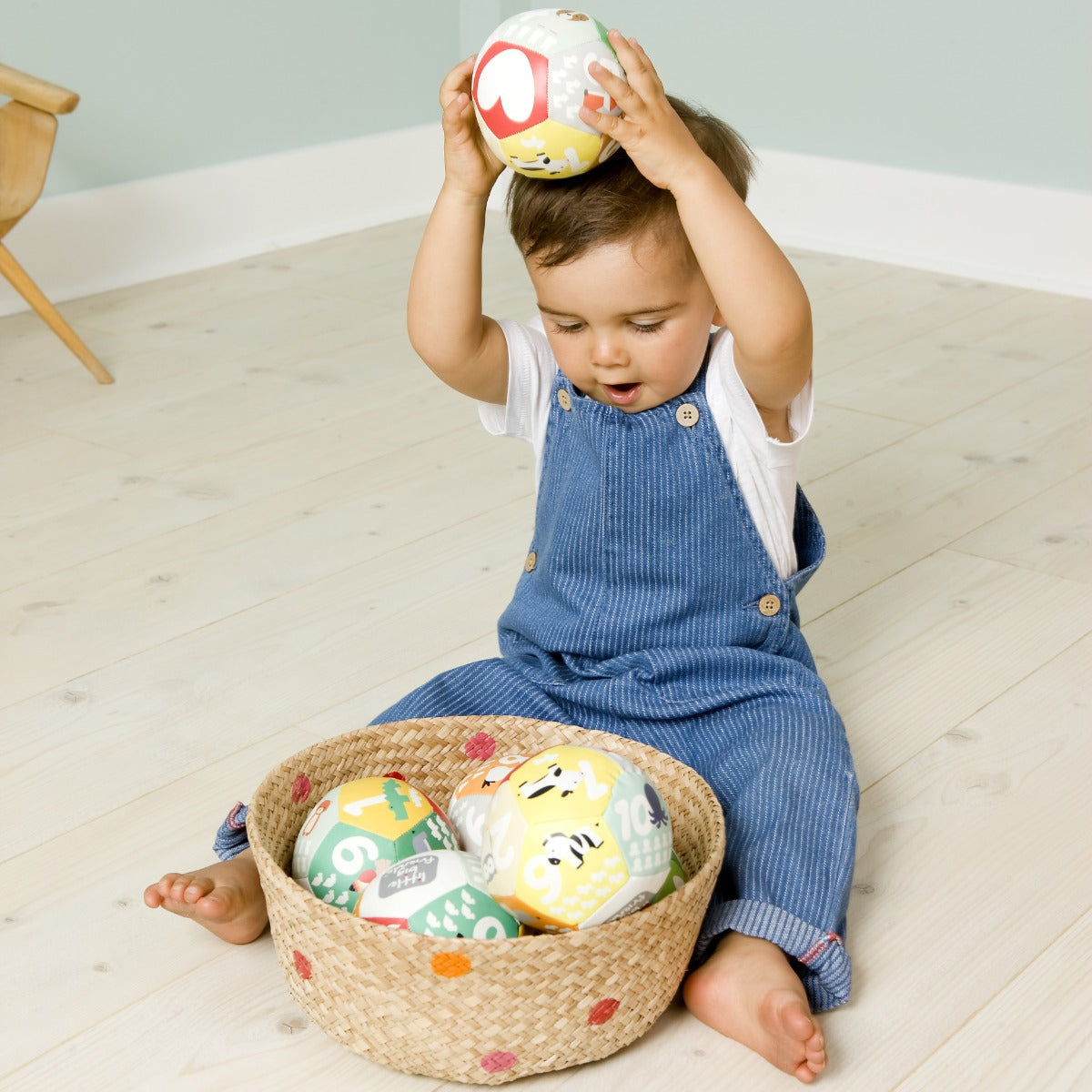 Toddler playing with Little big friends discovery soft ball for kids with numbers and animals