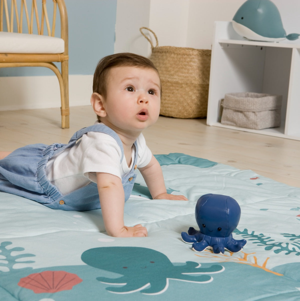 Baby playing on Reversible kids playmat in ocean print from Little Big friends