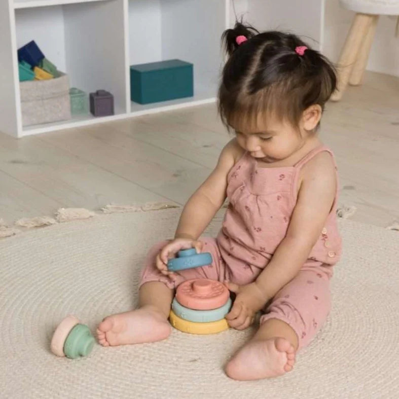 Young child playing with Stack & Learn Rings
