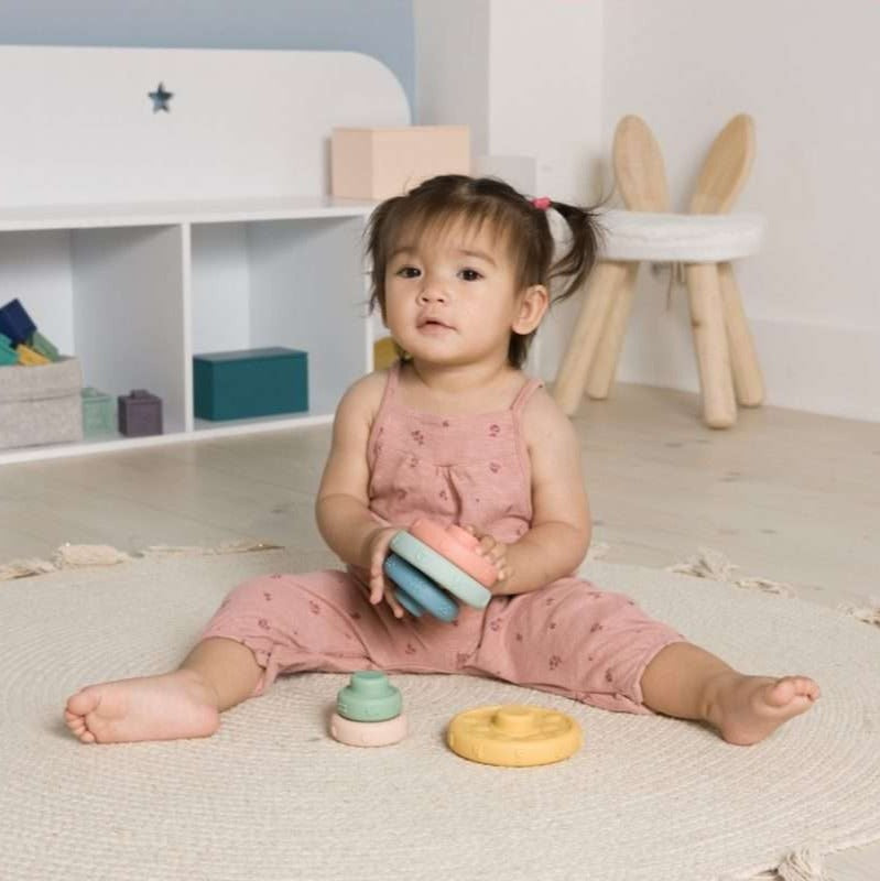 Young child playing with Stack & Learn Rings