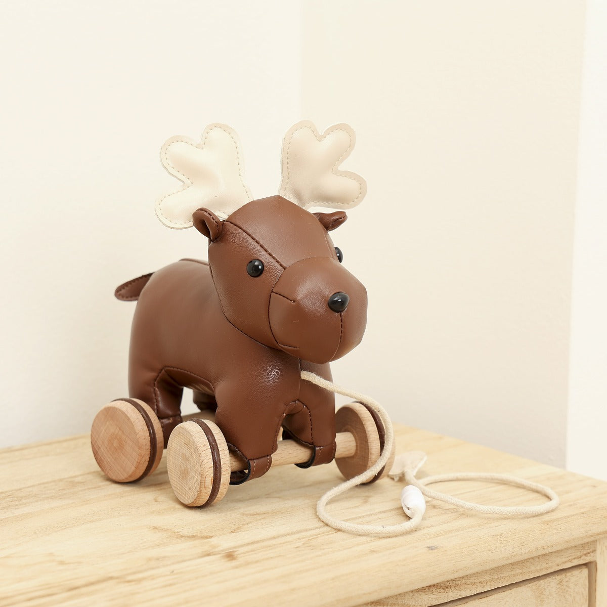 Little Big Friends Pull Along Moose on a table