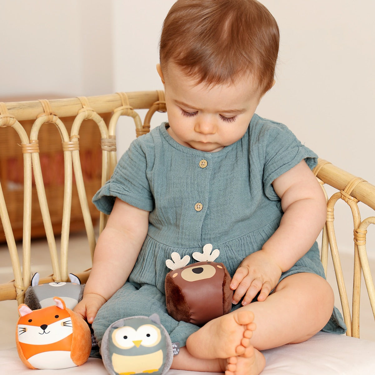 Giel playing with Roly Poly soft animals balls for kids from Little Big Friends