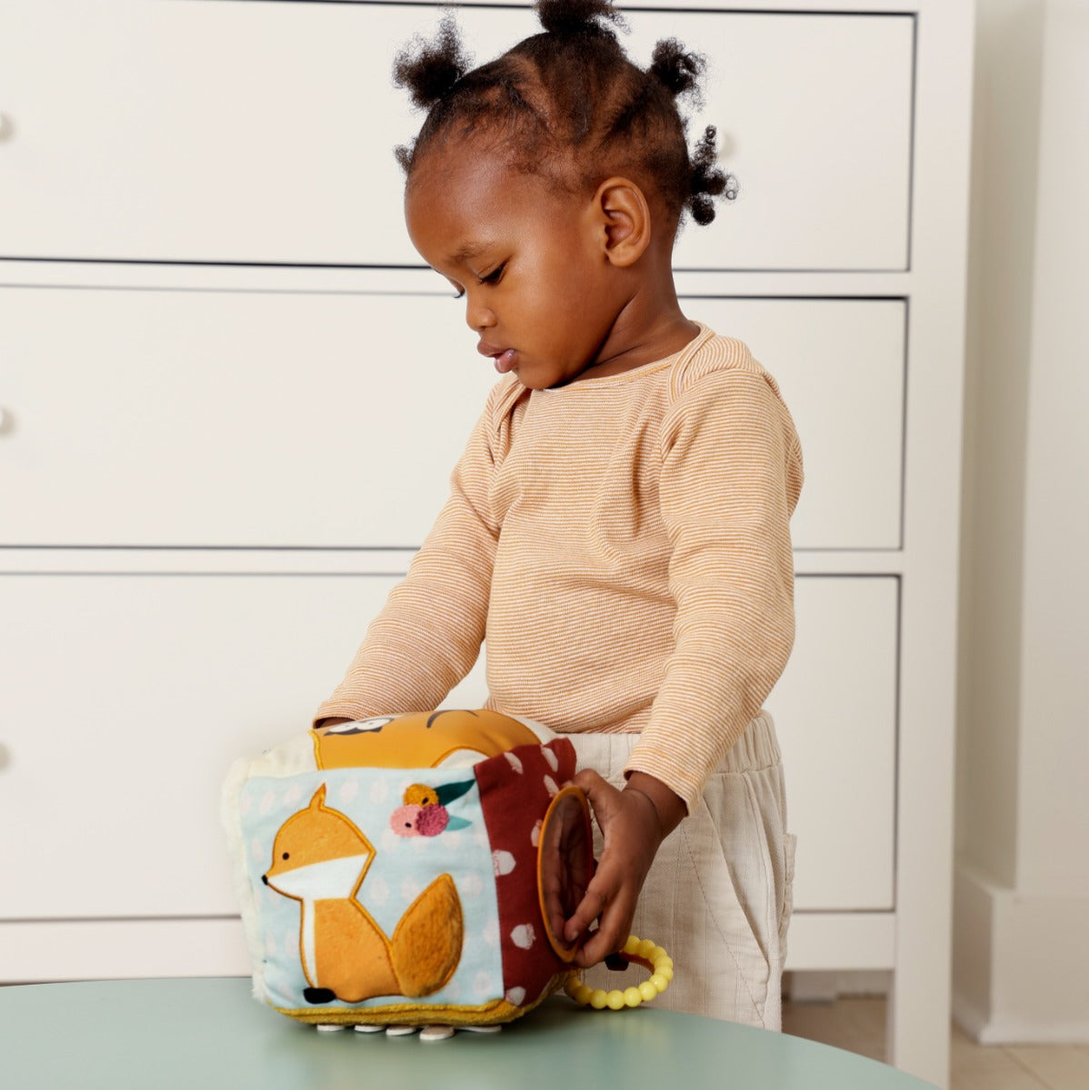 KKid playing with Little Big Friends Soft Activity Cube Forest