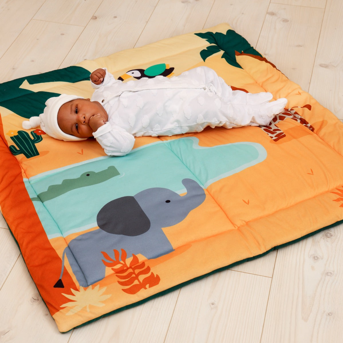 Baby sleeping on Little Big Friends Patchwork kids reversible playmat